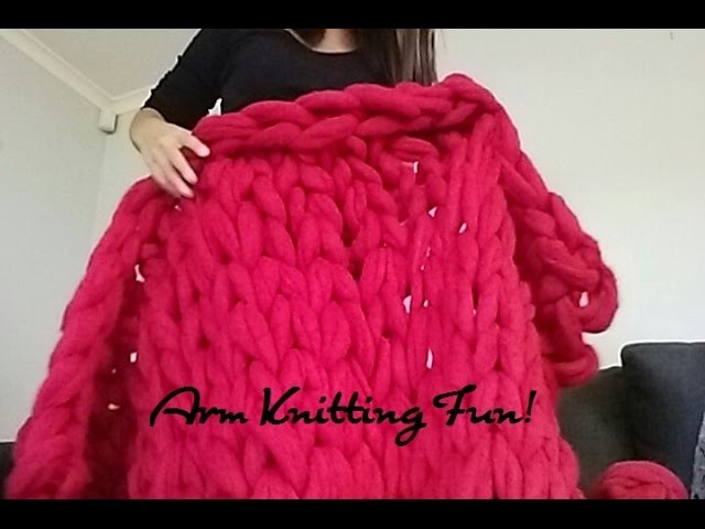 Arm Knitting A Blanket With Giant Balls Of Merino Wool