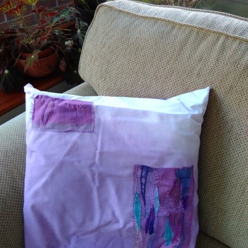 Cotton cushion in purple dip dye with applique embellishment