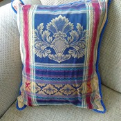 Damask blue cushion with piped edging