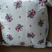 Floral patterned cushion with hand embroidered panel
