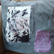 Pair of green velvet cushions with abstract applique embellishment