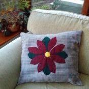 Wool check cushion in red & green with flower applique