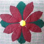 Wool check cushion in red & green with flower applique