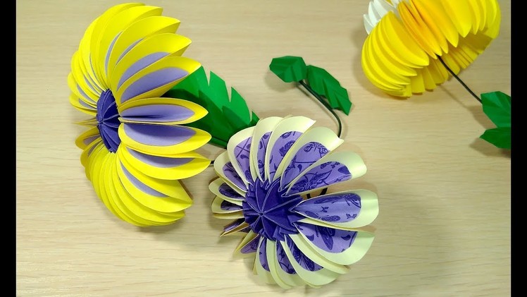 Paper flower from circles in origami style.