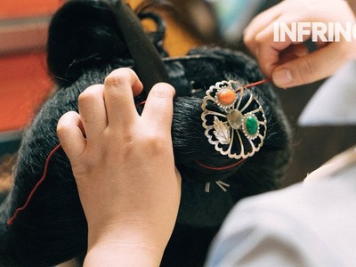 A rare look at the creation of a traditional hairstyle of a Geiko-in-training