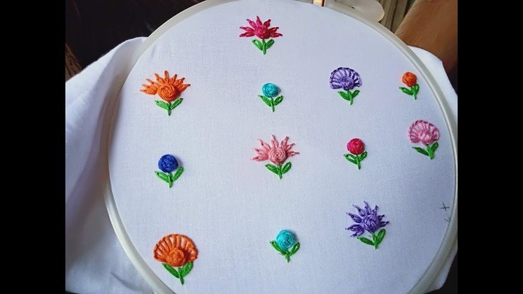 Hand embroidery.Raised cross stitch flower.Hand embroidery all over design for shirts and frocks.