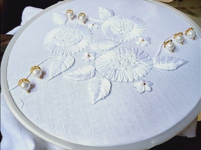 Hand embroidery.White work embroidery design.