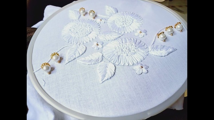 Hand embroidery.White work embroidery design.