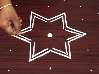 Beautiful star kolam designs witth 7x4 dots - simple rangoli designs for kids - easy flower muggulu
