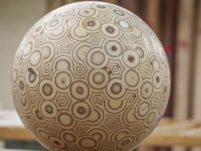 Guy makes a big ball out of plywood