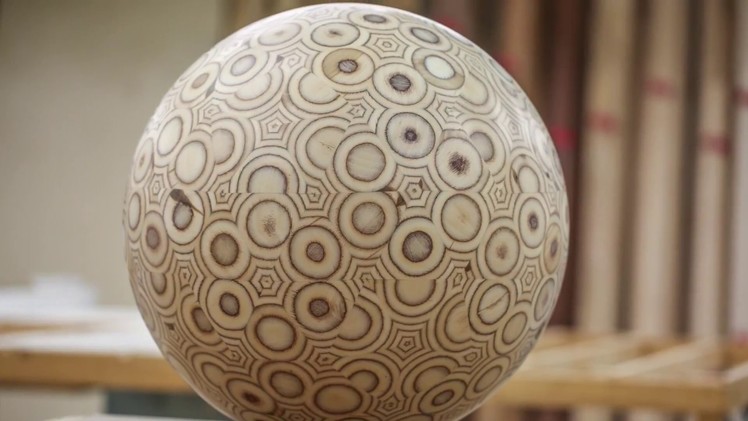 Guy makes a big ball out of plywood