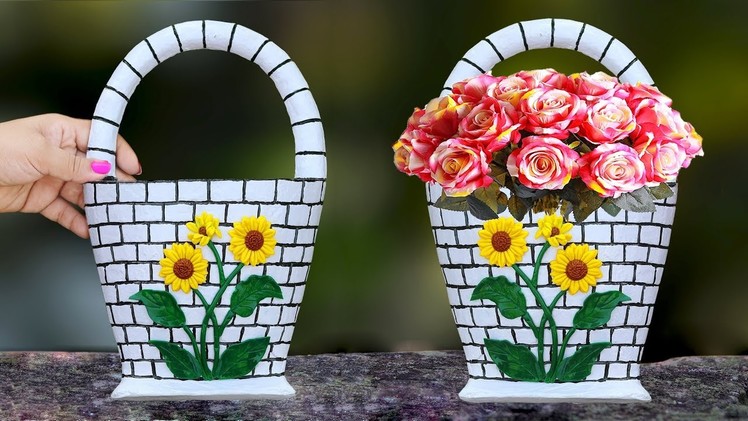 Wall hanging flower vase. Plastic Bottle flower vase at home