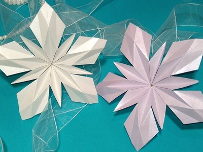 Paper snowflake in origami style. Origami star. Ideas for Christmas decorations