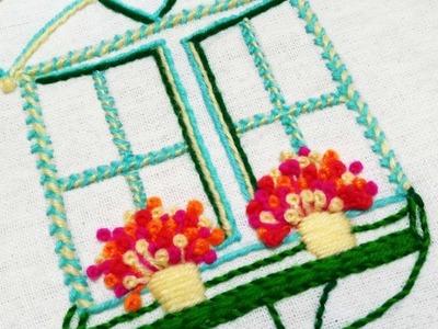Hand embroidery design of a window with flower pots