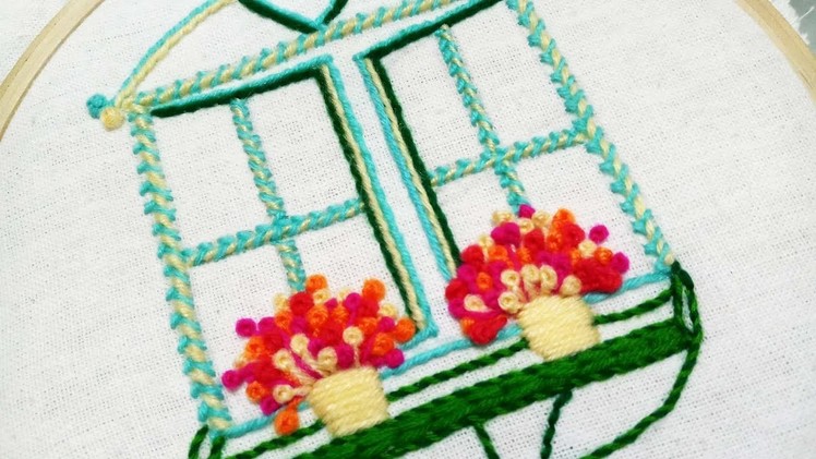Hand embroidery design of a window with flower pots