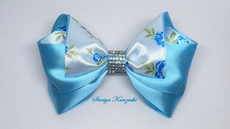 The decoration on the hairpin Kanzashi. Blue bow with roses