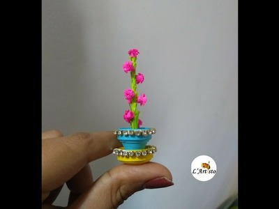 Paper Flower Pot: How to make small flowers from paper strips - LArtisto | Kirthi | Nals