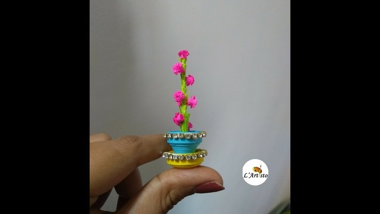Paper Flower Pot: How to make small flowers from paper strips - LArtisto | Kirthi | Nals