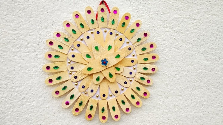DIY ice cream stick craft। How to make flower wall hanging by ice cream stick। Home decor ideas.