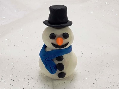 Learn how to make a snowman with play doh and sing Jingle Bells to a happy new year video!