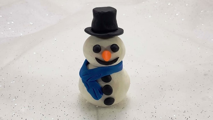 Learn how to make a snowman with play doh and sing Jingle Bells to a happy new year video!