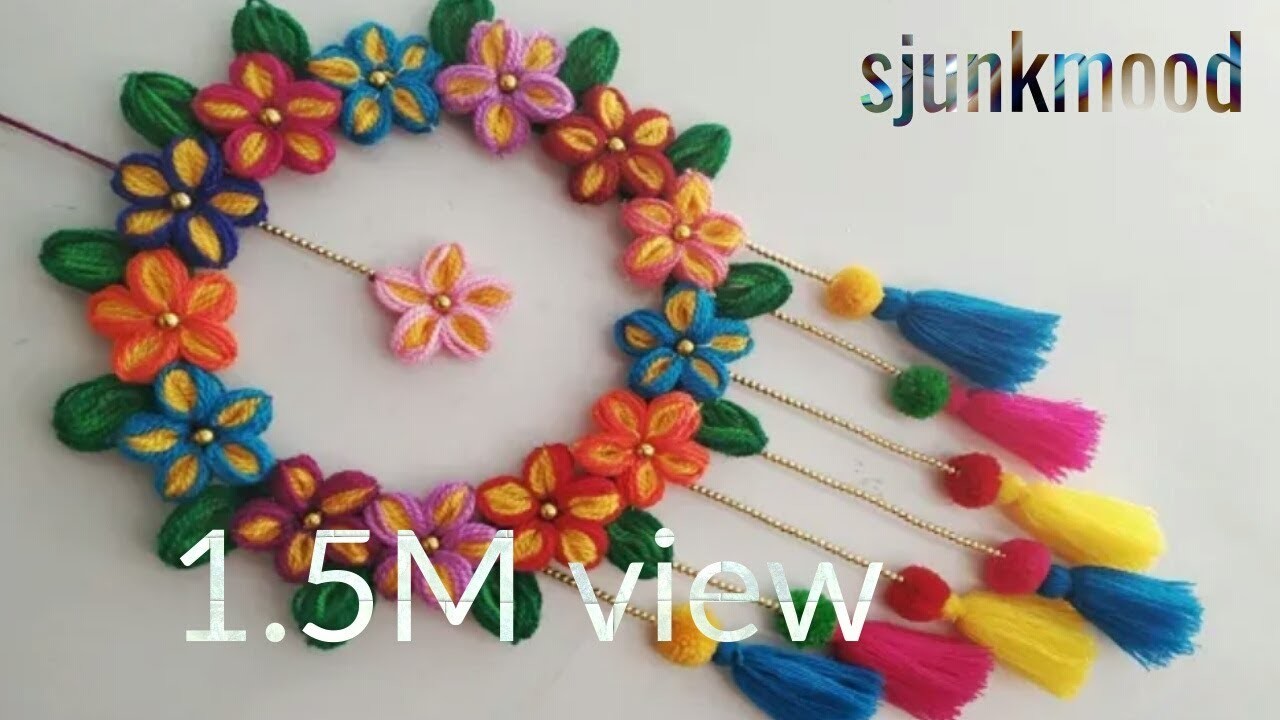 Diy wall hanging out of waste material. thread. flower making. room