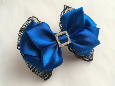The decoration on the hairpin Kanzashi. A bow of satin ribbon and lace