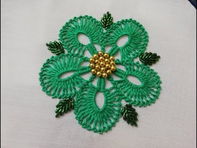 Hand embroidery:flower embroidery with beads.
