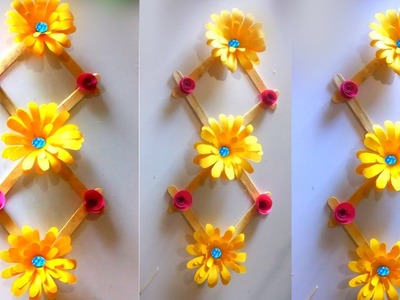 Make decoration paper flowers. ice cream stick design. wall hanging flowers