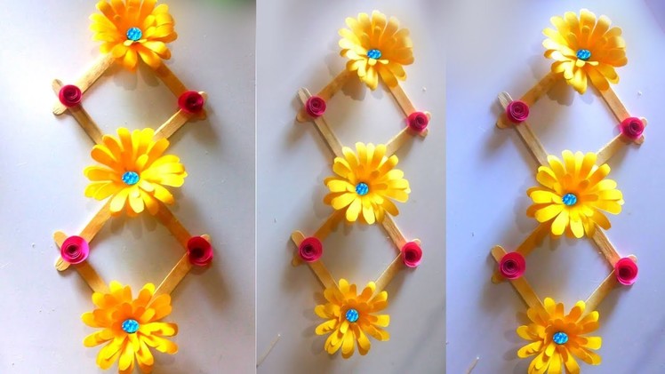 Make decoration paper flowers. ice cream stick design. wall hanging flowers