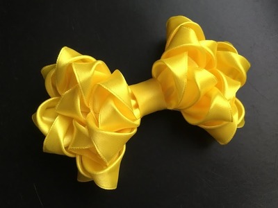 The decoration on the hairpin Kanzashi. Lush yellow bow