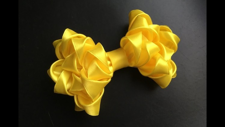 The decoration on the hairpin Kanzashi. Lush yellow bow