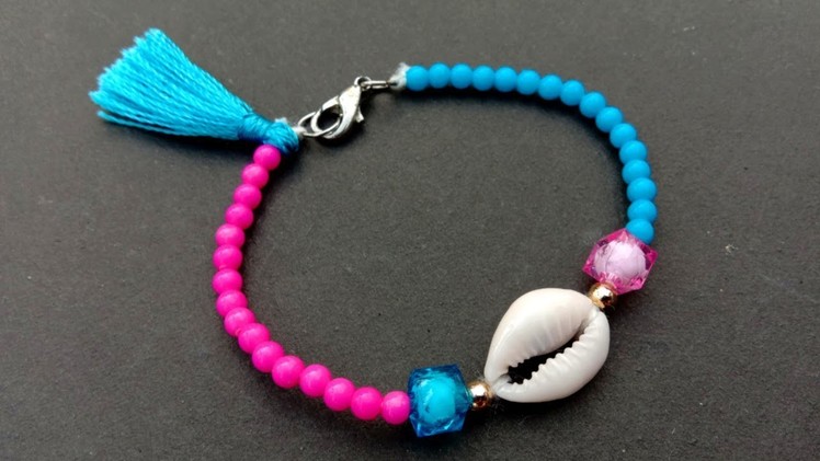 Making jewelries. out of cowrie shell. How to make. cowrie shell bracelet easily
