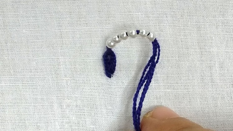 Hand embroidery pearl border design for dress.