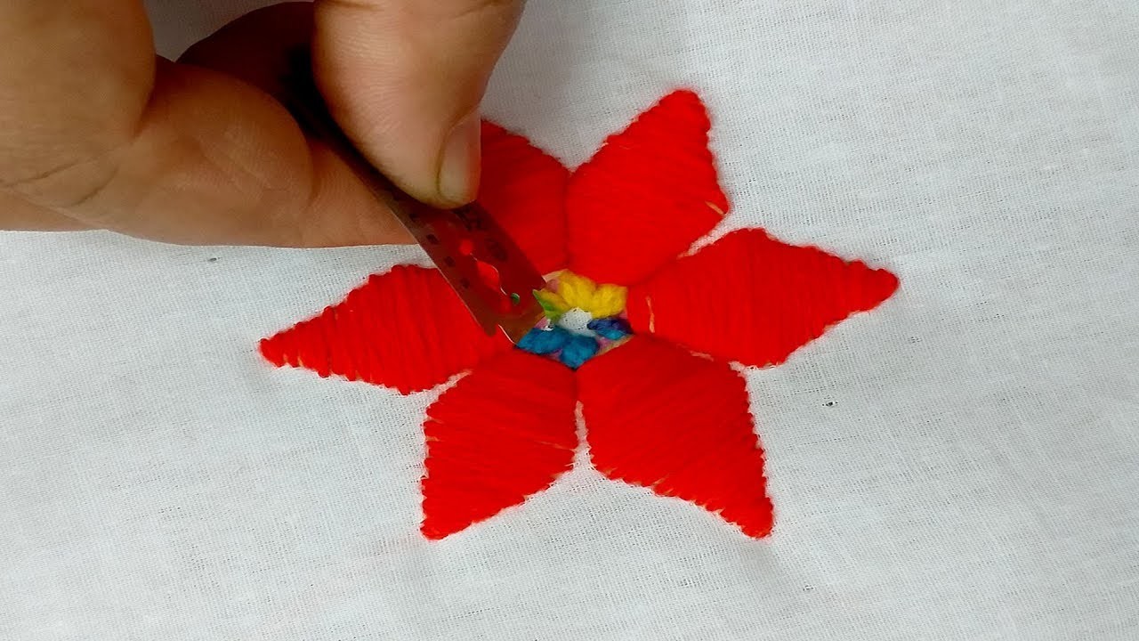 Hand embroidery trick Amish plushwork flower design for dress.
