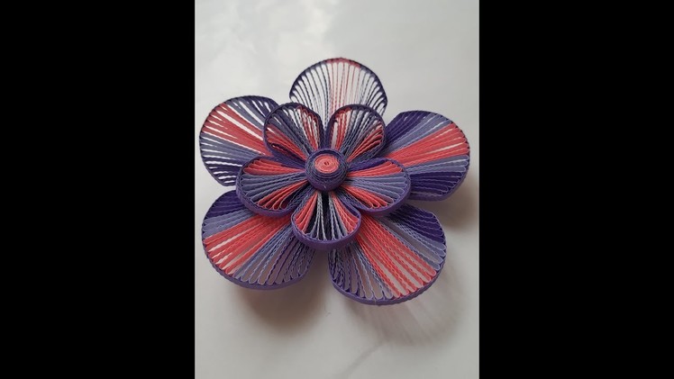 How to make a 3D quilling flower using a husking board. grid guide
