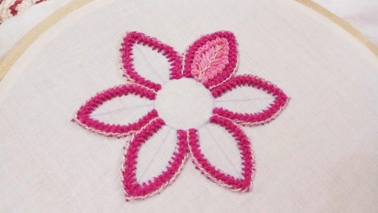 Hand embroidery of a flower with knotted pearl stitch and pistil stitch