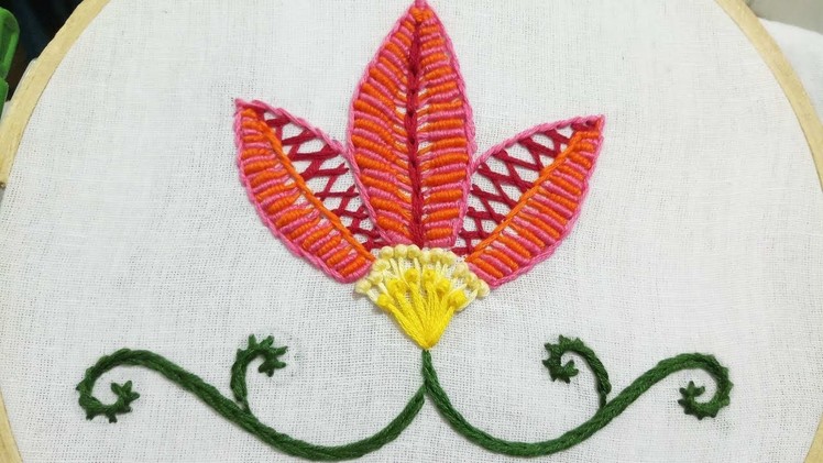 Hand embroidery of a flower with bullion and herringbone stitch