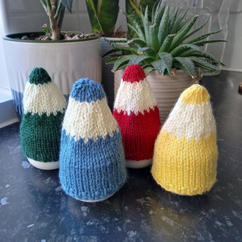 Fun handmade egg cosies egg covers in shape of pencil tops