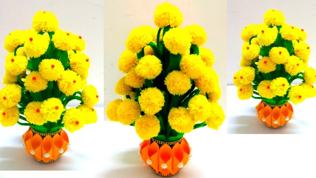 MAKE PLASTIC BOTTLE AND WOOLEN FLOWER POT.HOW TO MAKE YARN FLOWERS.VASE OF X-RAY PAPER.WOOL