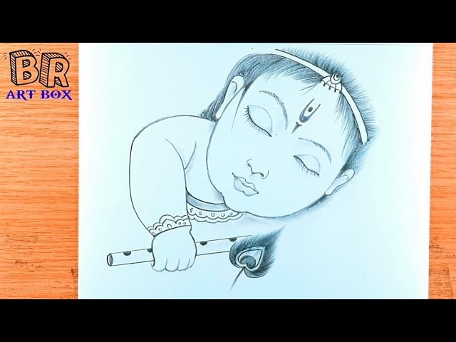Little Krishna is sleeping with his drawing. lord Krishna pencil drawing