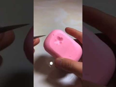 Soap carving a flower with a leaf