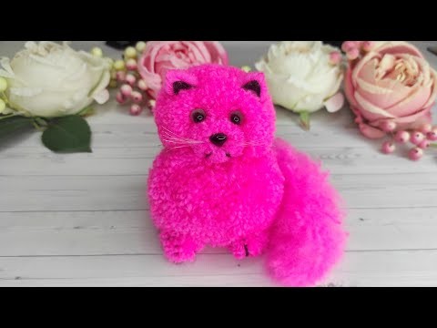 A  Cats Making of pom-poms. A  Cats made of Wool Yarn. DIY ideas from pom-poms.