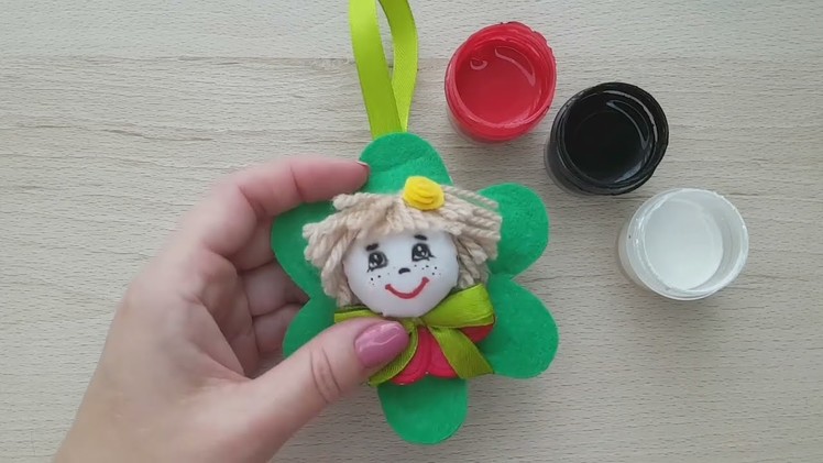 Naughty doll pendant for keys made of pieces of fabric and felt