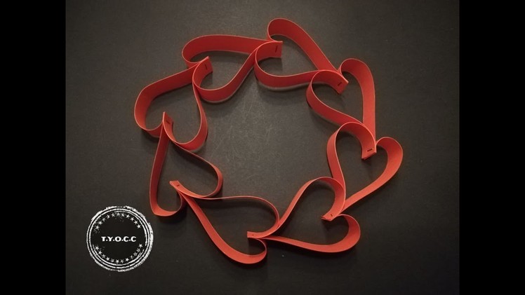 VALENTINE WREATH MADE OUT OF PAPER STRIPS.VALENTIJN HARTJES KRANS GEMAAKT VAN PAPIER