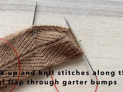 Pick up and knit stitches along the heel flap through garter bumps