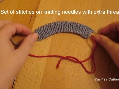 Set of stitches on knitting needles with extra thread @Vasilisa Catherine