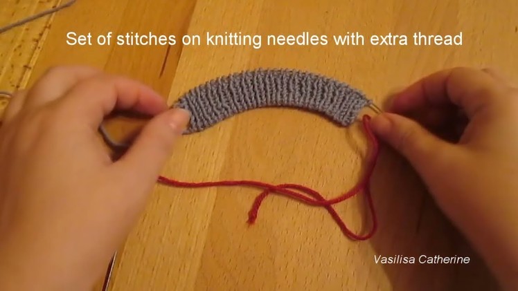 Set of stitches on knitting needles with extra thread @Vasilisa Catherine