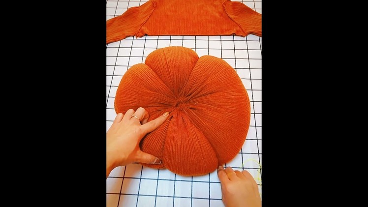 Cut a pumpkin cushion out of a discarded sweater