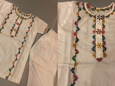 Multi coloured hand embroidery on white dress
